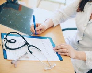 A medical worker documents a service contained in a chargemaster