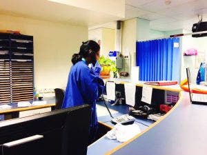 A medical professional working with healthcare records.