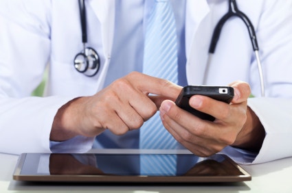 Healthcare professional holding smartphone