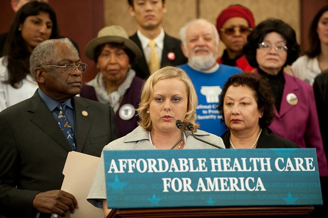 Image of citizens speaking at podium on affordable health care for america.